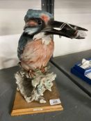 20th cent. Ceramics: G. Armani Capo-di-monte figure of a kingfisher holding a fish, perched on a