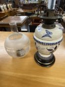 20th cent. Hinks & Son patent oil lamp decorated with flowers.