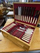 20th cent. Oak cased canteen of cutlery with drawer beneath.