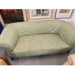 19th cent. Three seat settee green loose cover over liner on turned supports.