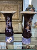 20th cent. Japanese vases, blue ground decorated with a stylised dragon motif. 8½ins.