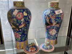 19th cent. Cantonese baluster shaped vases and covers, blue ground and multicoloured enamels