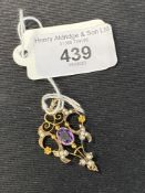 Late 19th/early 20th cent. Drop pendant set with seed pearls and amethyst marked and tested 9ct. 2.