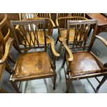 Georgian style mahogany elbow chairs with a reed rail back on square tapered legs and brown