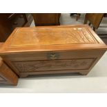 20th cent. Chinese hardwood chest the panels carved with bamboo relief on step bracket supports.