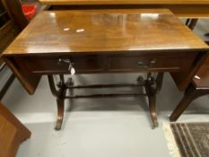 Reproduction mahogany sofa table, fitted two drawers on lyre end supports. 58¾ins when open.