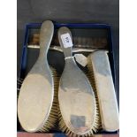 Silver: Four piece dressing table set, two hairbrushes, one comb, and one clothes brush,