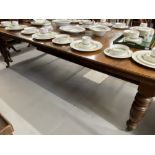 19th cent. Mahogany dining table with two leaves, on turned supports, with winder. Extended 94ins. x