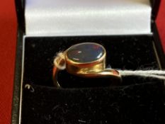 Hallmarked Jewellery: 18ct. Gold ring set with an oval black opal. Hallmarked Sheffield. Weight 4·