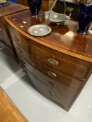 19th cent. Mahogany bow front chest of two over three drawers with ebony and boxwood inlay, on swept