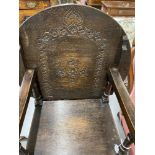 20th cent. Oak monks chair with turned gun barrel supports.