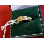 Hallmarked Jewellery: 18ct. Gold crossover ring set with seven brilliant cut diamonds (known