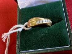 Hallmarked Jewellery: 18ct. Gold crossover ring set with seven brilliant cut diamonds (known