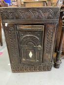 18th cent. Heavily carved chest corner cupboard with small inset lozenge mirror decoration. 27in.