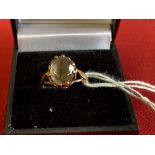 Jewellery: Yellow metal ring set with an oval cut citrine, tests as 9ct. gold. Weight 2·1g.