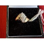 Hallmarked Jewellery: 9ct. Gold ring in the form of a kite, shaped cluster peg set 10 white gold