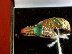 Jewellery: Two yellow metal rings, one set with an oval cut emerald with six brilliant cut