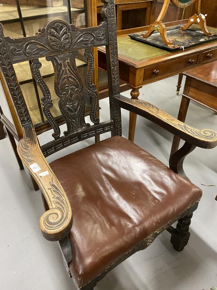 19th cent. Oak carver chair with bobbin turned front supports and red leather seat.