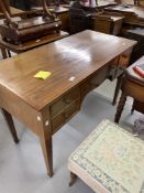 Early 20th cent. Mahogany desk, five drawers above a stylised apron. 46½in. x 22in.