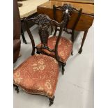 Late 19th/early 20th cent. pair of ebonised mahogany nursing chairs with pierced slat backs.