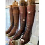 Equestrian: Two pairs of vintage red leather riding boots.