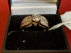 Jewellery: Yellow metal ring set with cubic zirconian, tests as 9ct. gold. Weight 4·4g.