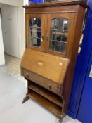 Edwardian Mahogany bureau bookcase with galleried top, leaded glazed doors, and bronze drop handles.