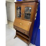 Edwardian Mahogany bureau bookcase with galleried top, leaded glazed doors, and bronze drop handles.