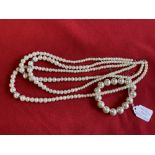 Jewellery: Triple row necklet of graduated simulated pearls, plus bracelet also of simulated