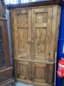 19th cent. Two section stripped pine corner cupboard. 81ins. x 51ins.