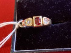 Gold Jewellery: Stamped 18ct. ring set with two old cut diamonds 0.20ct. total with a central