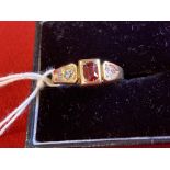 Gold Jewellery: Stamped 18ct. ring set with two old cut diamonds 0.20ct. total with a central