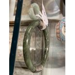 Jewellery: Oriental Chinese jade bangle with silver fittings and a jade ring as a entwined band with