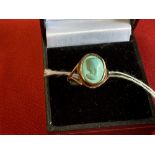 Hallmarked Jewellery: 9ct. Gold ring set with a turquoise, carved with a lady's head. Hallmarked