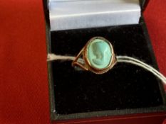 Hallmarked Jewellery: 9ct. Gold ring set with a turquoise, carved with a lady's head. Hallmarked