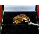 Hallmarked Jewellery: 9ct. Gold crossover ring, set with three marquise cut citrine, hallmarked