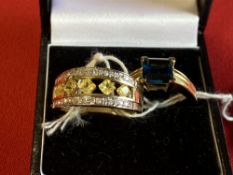 Jewellery: Yellow metal two rings one set with yellow sapphires and diamonds and one set with a blue