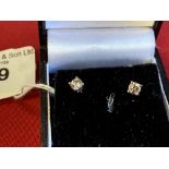 Diamond solitaire earrings each set in white gold, test 18ct. 0·40 the pair, weight inclusive 1g.