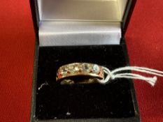 Hallmarked Jewellery: 9ct. Gold ring set with four round aquamarines as a half hoop. Hallmarked