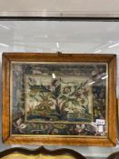 19th cent. Woolwork sampler depicting wild animals in jungle surrounds in a birds eye maple frame,