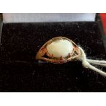 Hallmarked Jewellery: 9ct Gold ring set with an oval cabochon cut opal, hallmarked Birmingham.