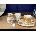 19th cent. Ceramics: Royal Worcester coffee cup and saucer, ivory ground decorated with embossed