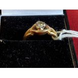 Jewellery: Yellow metal ring set with a brilliant cut diamond. Known weight 0·25ct. set in white
