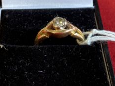 Jewellery: Yellow metal ring set with a brilliant cut diamond. Known weight 0·25ct. set in white