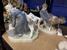 20th cent. Ceramics: Royal Copenhagen Girl Feeding a Cow, model no. 779 plus a Boy with Cow, model