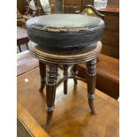 19th cent. Beech frame circular extending piano stool, treen worm and leather seat.