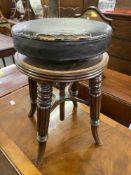 19th cent. Beech frame circular extending piano stool, treen worm and leather seat.