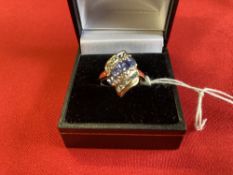 Hallmarked Jewellery: 9ct. Gold ring, triple row crossover, centre row set with five oval tanzanite,