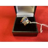 Hallmarked Jewellery: 9ct. Gold ring, triple row crossover, centre row set with five oval tanzanite,