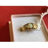 Hallmarked Jewellery: 22ct. Gold ring set with an oval opal and two seed pearls. Weight 3·9g.